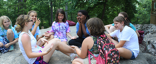 Our Program Volunteer reading to girls