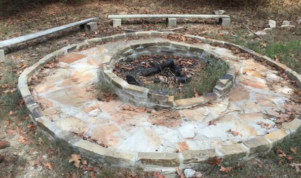 outside fire circle at Radford House lodge girl scout property