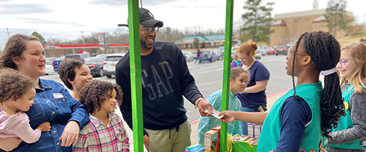Girl Scouts selling cookies