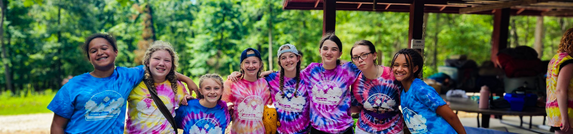  Group of girls wearing orange helmets and climbing gear 