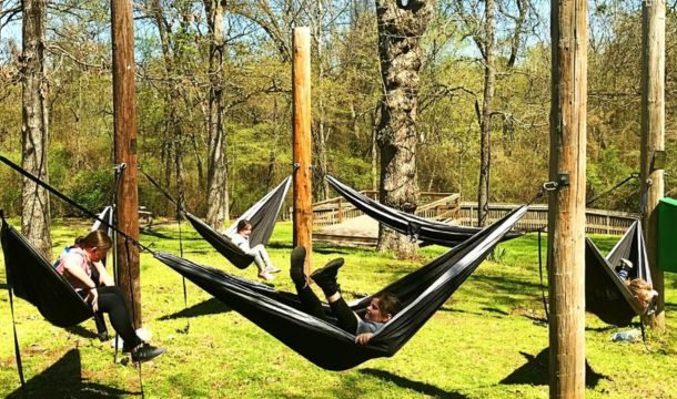 wooden poles at burnham woods girl scout property set up to hang hammocks for relaxing and camping
