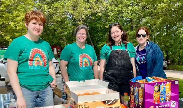 adult volunteers with girl scouts