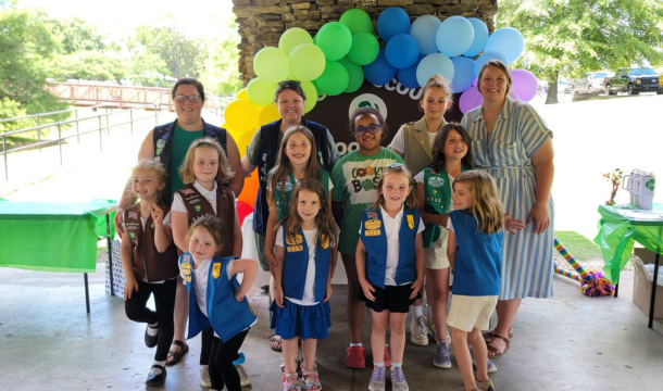 adult volunteers with girl scouts